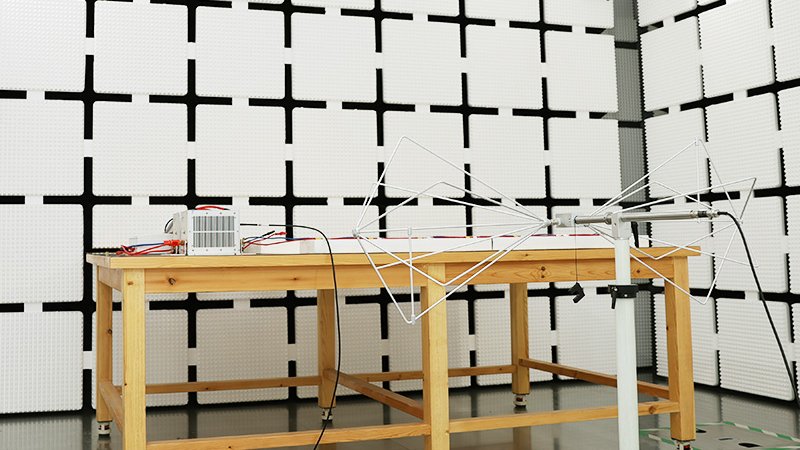 An LED work light on an EMC radiated emissions test bench in a semi-anechoic chamber