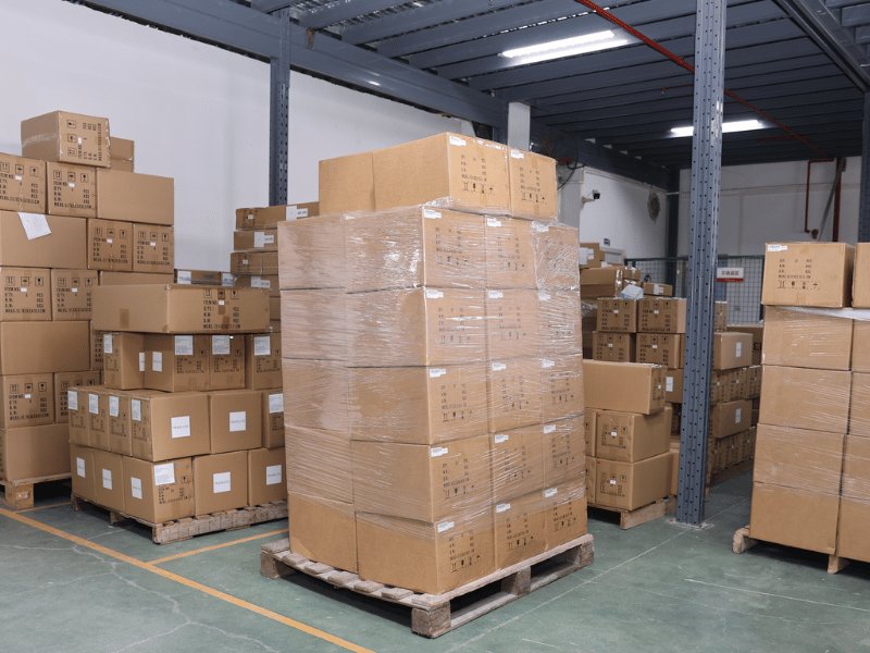 Shrink-wrapped pallet of packed LED work lights staged for export shipment